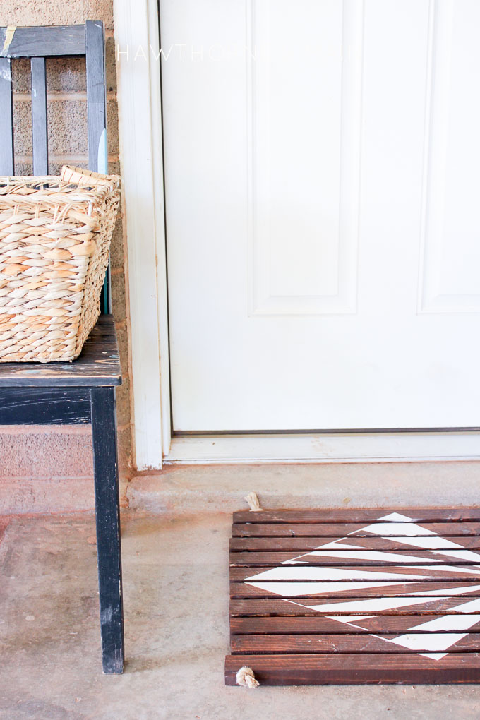 Check out this simple wood slat door mat! I love the geometric pattern that she added to it. This really would be so fun to make for our side entry to help with dirt! 