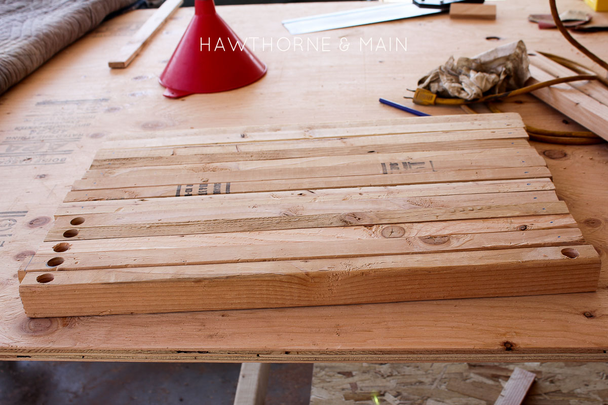 Check out this simple wood slat door mat! I love the geometric pattern that she added to it. This really would be so fun to make for our side entry to help with dirt! 