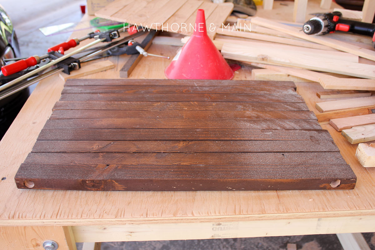 Check out this simple wood slat door mat! I love the geometric pattern that she added to it. This really would be so fun to make for our side entry to help with dirt! 