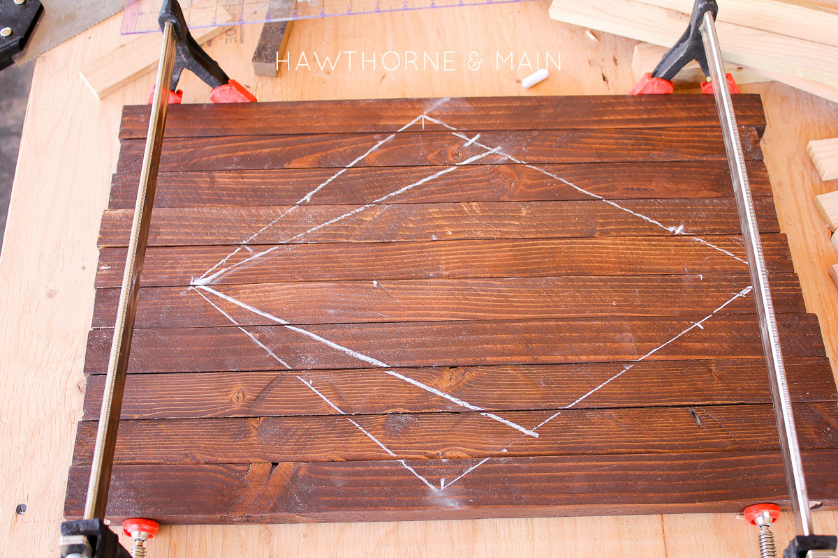 Check out this simple wood slat door mat! I love the geometric pattern that she added to it. This really would be so fun to make for our side entry to help with dirt! 