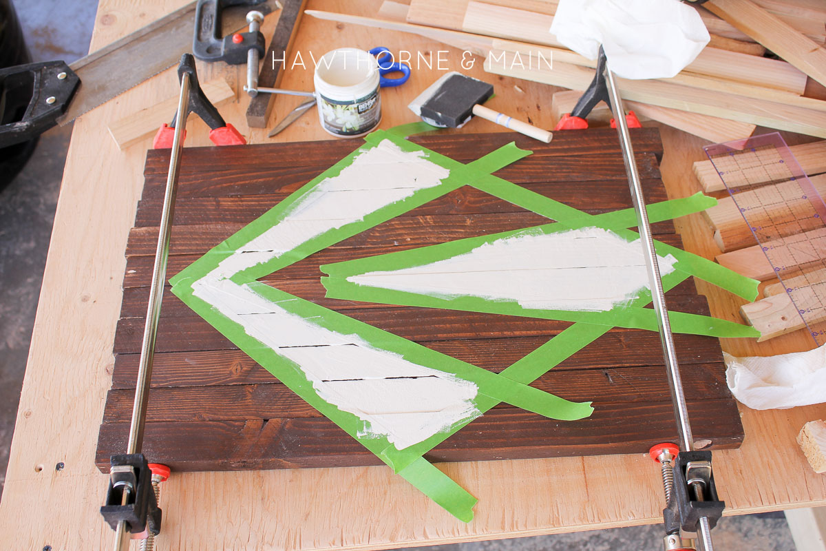 Check out this simple wood slat door mat! I love the geometric pattern that she added to it. This really would be so fun to make for our side entry to help with dirt! 