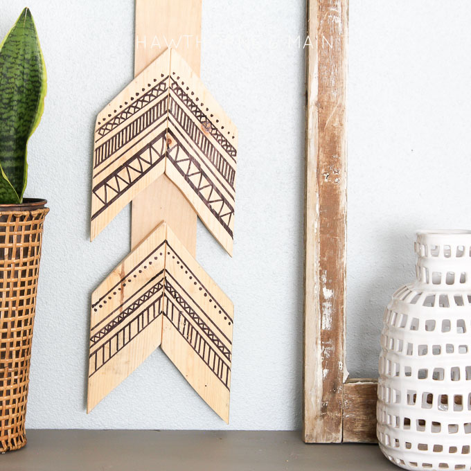 Tribal decor is so popular right now. Come learn how easy this tribal arrow wall art was to create. Let me show you how to make one too! Can you guess what was used to make the black lines? 