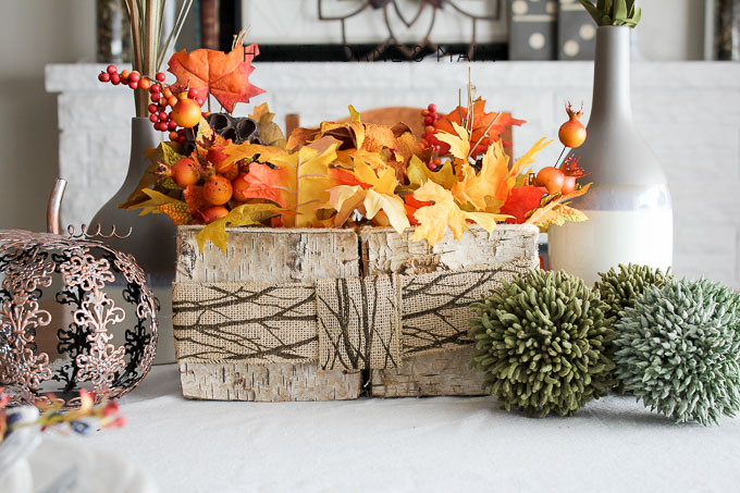 Fall is in the air, or will be soon! Here is a woodsy fall centerpiece piece that is the perfect mix of rustic with a tradition fall feel.  I love the aspen box!