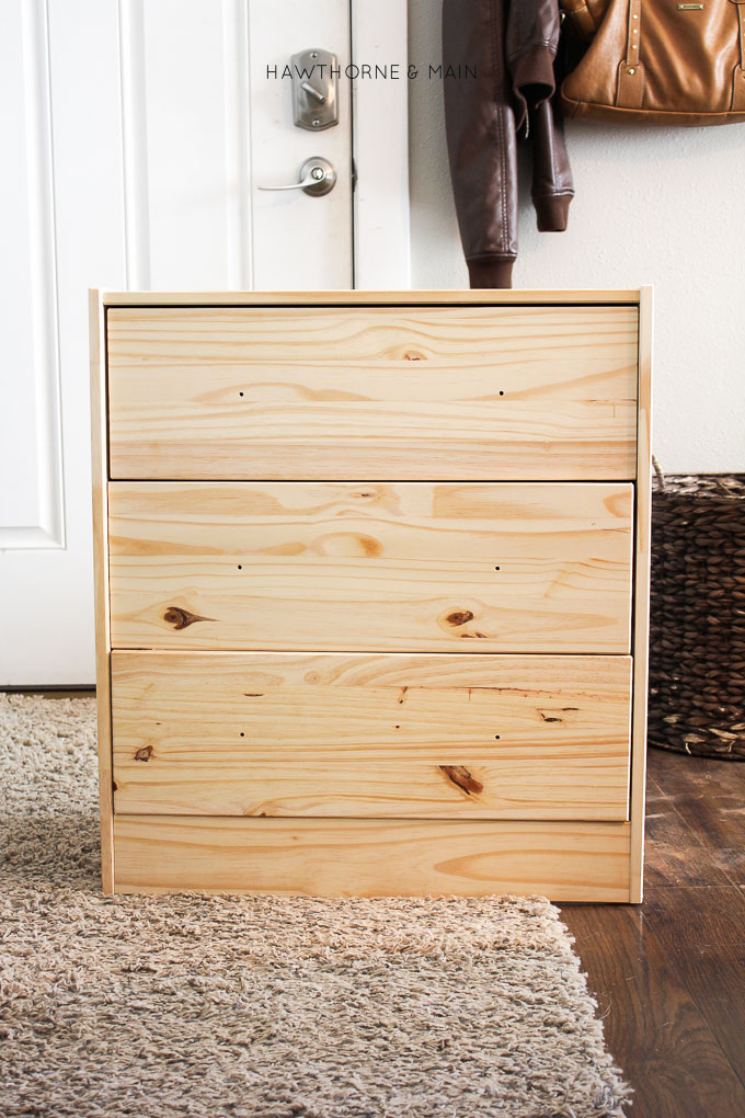 Love this IKEA RAST hack. All you need are a few supplies to make over this cheap ikea dresser into a sleek modern mid century dresser or night stand. 