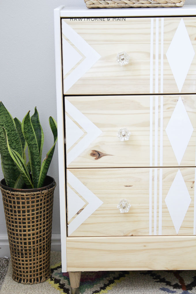 Love this IKEA RAST hack. All you need are a few supplies to make over this cheap ikea dresser into a sleek modern mid century dresser or night stand. 