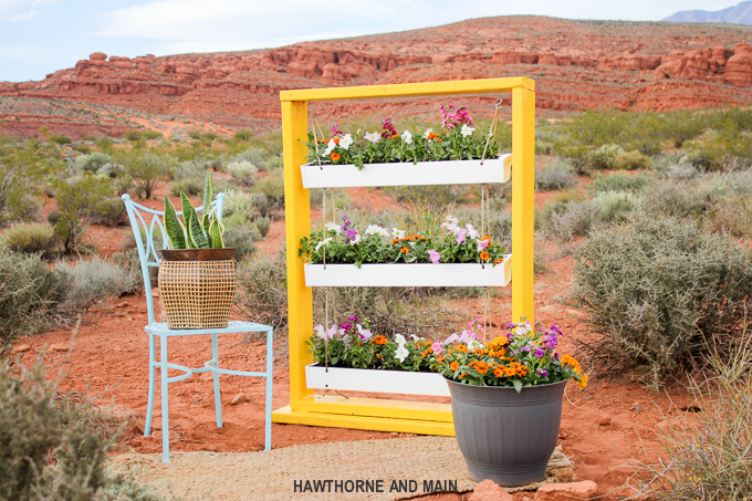 DIY Hanging Gutter Planter. This is a really fun and easy afternoon project that is sure to brighten up your outdoor space. 