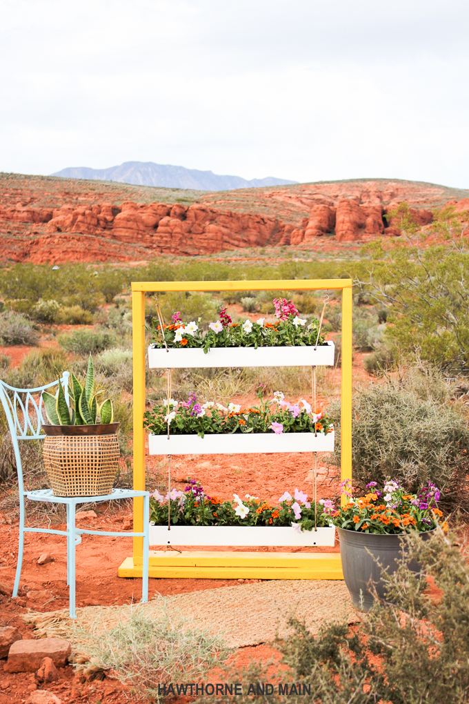 DIY Hanging Gutter Planter. This is a really fun and easy afternoon project that is sure to brighten up your outdoor space. 