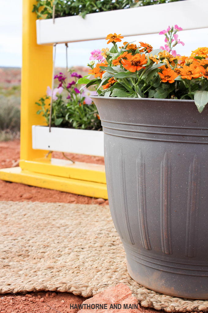 DIY Hanging Gutter Planter. This is a really fun and easy afternoon project that is sure to brighten up your outdoor space. 