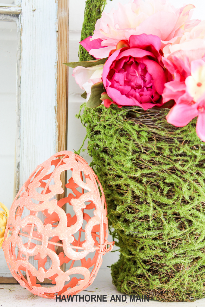 Spring Refresh with Easter Accents. This mantel is the perfect mix of spring and easter. I love pops of color and the pretty styling! 