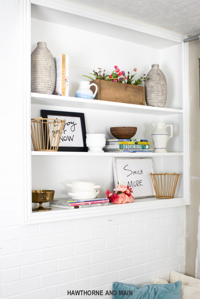 Love the styling on this built in bookcase. Love the bright and fun colors. Such great inspiration for my bookcase. Pinning for later!