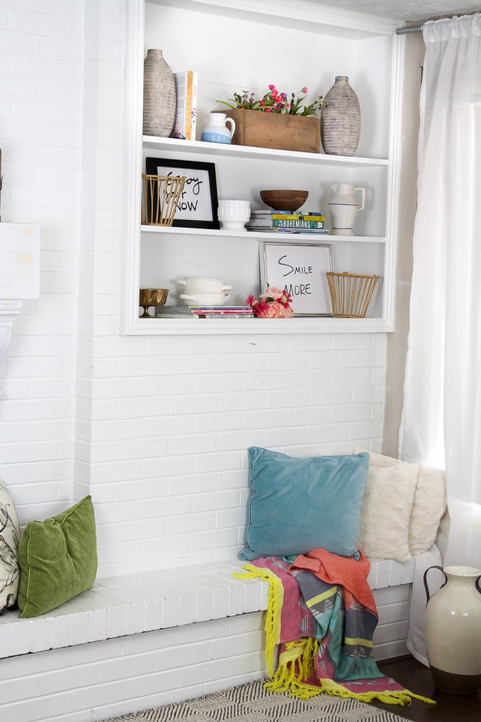 Love the styling on this built in bookcase. Love the bright and fun colors. Such great inspiration for my bookcase. Pinning for later!