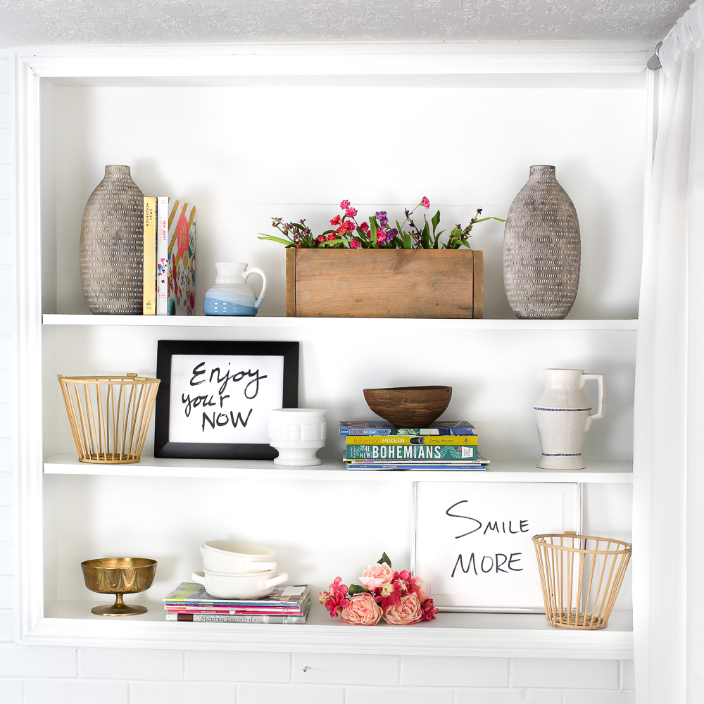 Love the styling on this built in bookcase. Love the bright and fun colors. Such great inspiration for my bookcase. Pinning for later!