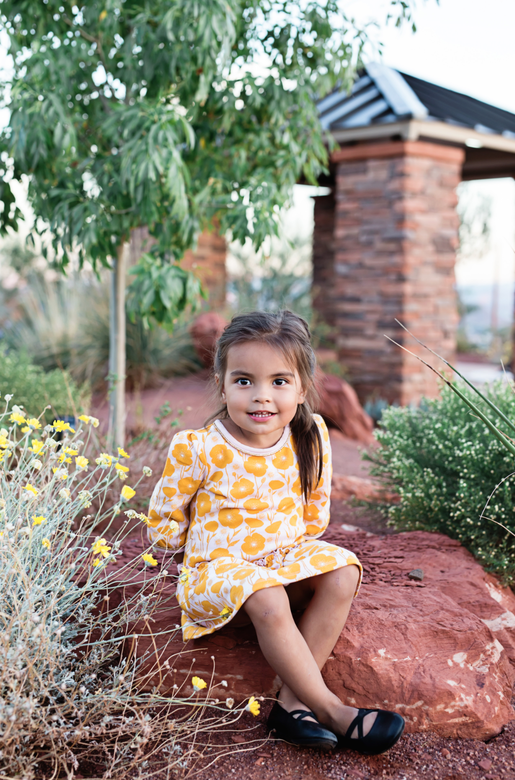 little-girl-sitting-on-a-rock 